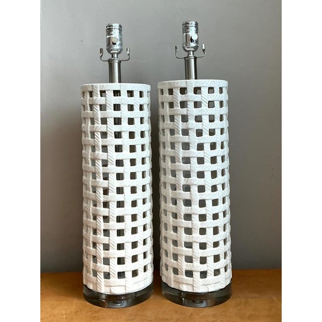 This pair of vintage table lamps sets a pierced ceramic cylinder against polished chrome and a clear base. Each tall,...