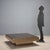 This 1980s-era wooden coffee table with smoked glass covering is an example of the elegant and functional design typical...