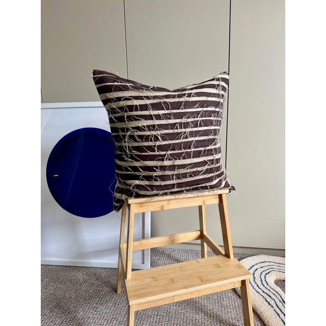 Linen cushion by London-based artist Alan Thomas. This piece is made from 100% linen in dark chocolate and beige. The...