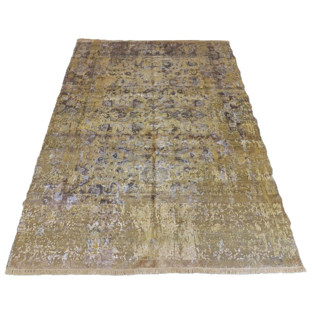 This is a real one-of-a-kind rug made of wool and real silk in high and low texture. The rug has a soft khaki green feel...