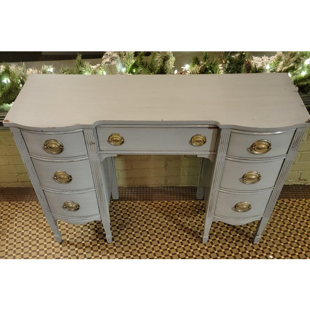 This mid-century Chippendale mahogany double pedestal desk could also serve as a vanity. It features a serpentine front,...