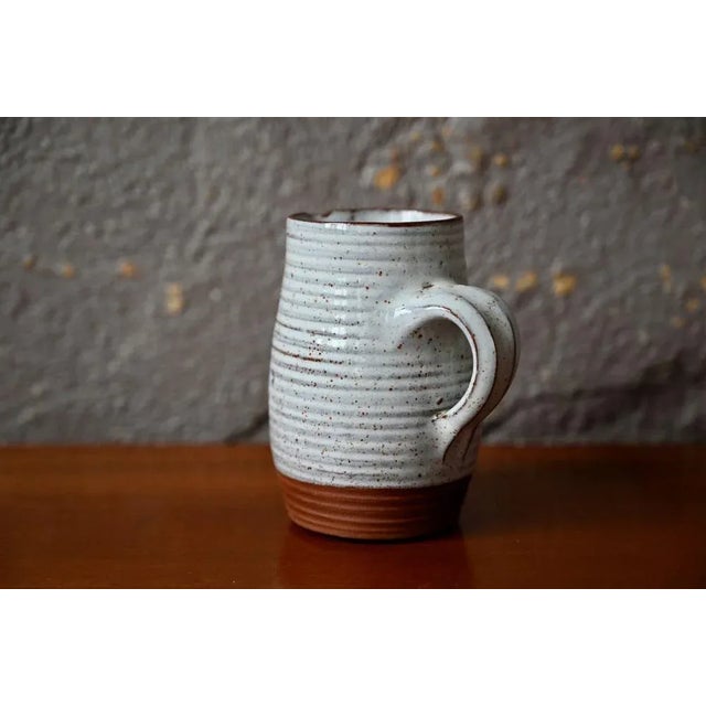 This small stoneware jug by talented potter Roger Jacques is touchingly simple. We love its simple, rustic and essential...