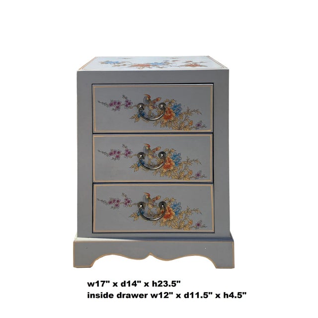 This is a simple end table nightstand made of wood and covered with a layer of vinyl. The surface is printed with oriental...