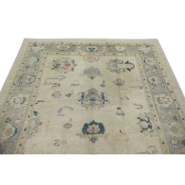 Early 21st Century Cream Handwoven Wool Turkish Oushak Rug in Pink & Blue Floral Design 6'1" X 9'1" For Sale - Image 4 of 7