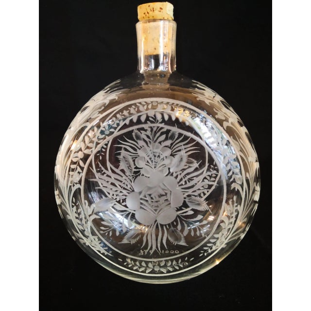 A set consisting of 2 different Murano glass bottles. Limited edition (155/1000, 746/1000) with cut designs in very good...