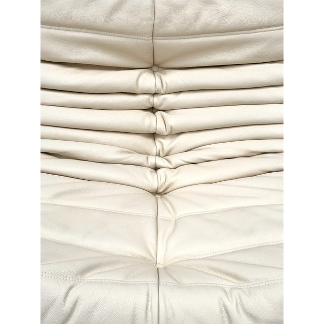 This Togo has been reupholstered with parts of new foam and leather, preserving its shape & iconic looks.The bottom could...