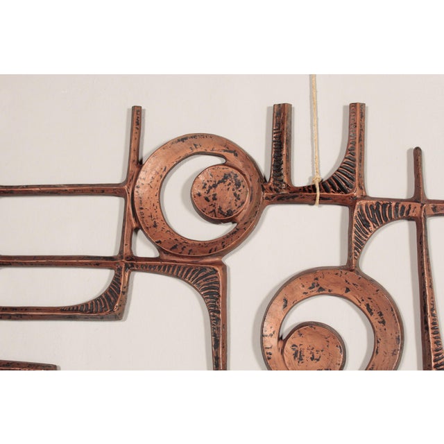 Large brutalist door panel or wall relief made of cast aluminum - copper patinated. There are multiple screw threads on...