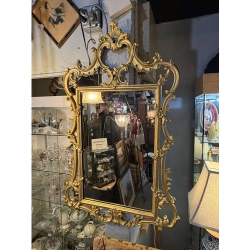 Vintage Italian Rococo Gilt Wood Mirror by Palladio. Very good condition all around. Gold enamel finish. Palladio tag on...