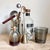 This incredibly rare and useful 3-in-1 barware tool from Napier is silver plated, and can be used as a bottle opener,...