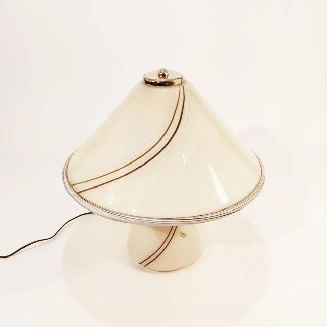Large Italian table lamp made of thick Murano glass, made by Venini in the 1970s in Venice. Mushroom-shaped body and shade...