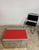 Red laminate & chrome rectangle coffee table. This table came from Johnson Publishing Company's offices in Chicago. This...