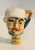 Whimsical baseball faces on brass bases lamp finials.