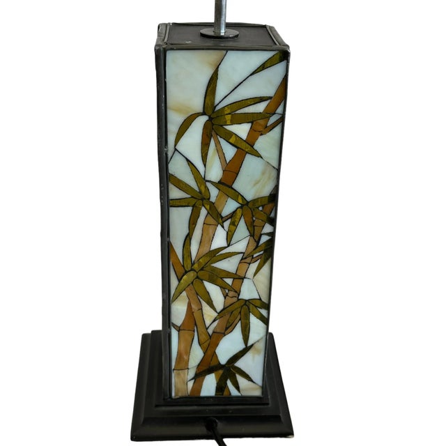 Unique four panel arts and crafts stained glass bamboo lamp with wooden base. This arts and crafts style lamp features...