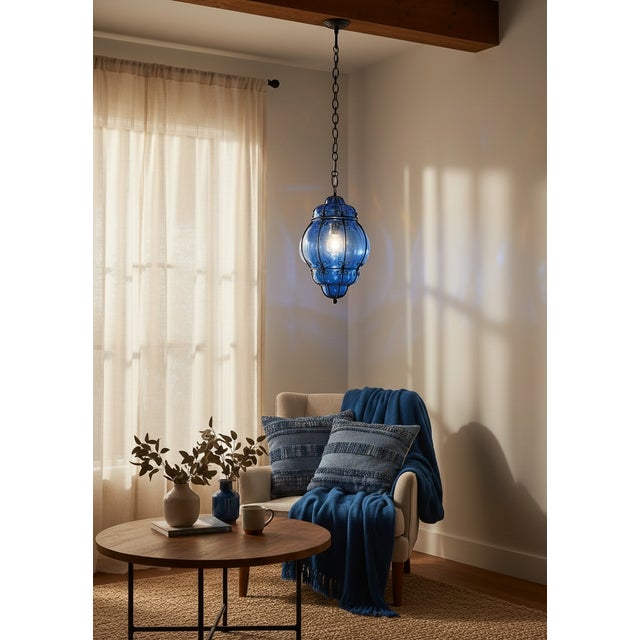 1980s Wrought Iron and Blue Murano Glass Lantern Pendant Light Striking Italian lantern pendant light from the 1980s...