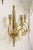 Pair of brass sconces with five shades. Some minor pitting on the stem.