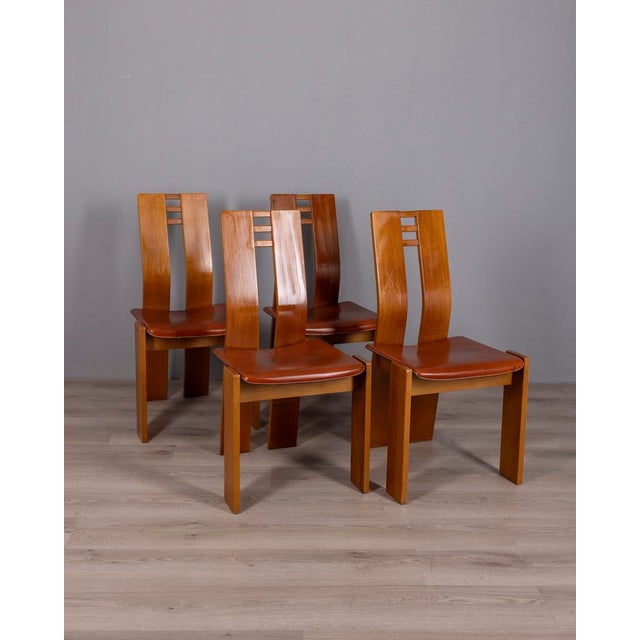 Set of four chairs with wooden frame and curved backrest, leather seat, Italian design, 1950s.