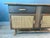 Versatile vintage wood sideboard cabinet. Style meets function with this Mid-Century Modern sideboard, circa 1960s. Faux...