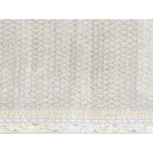 This lavish hand-knotted Persian Tabriz rug adds the perfect touch of elegance to any space. Its intricate design features...