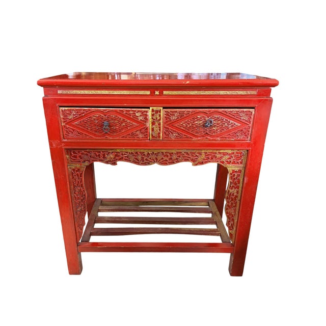 This stunning console table features 2 large drawers and is hand made from solid wood The vibrant red lacquer adds a pop...