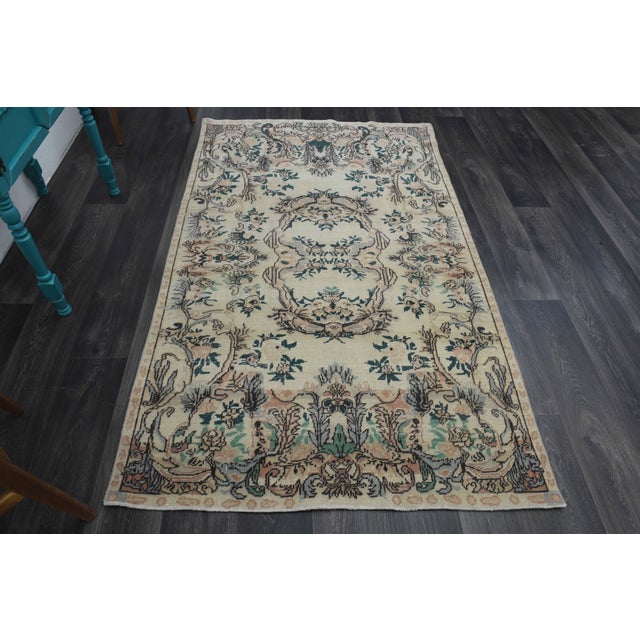 Vintage Hand-Knotted area rug is a semi-antique vintage area rug. The '70s Eastern region of Anatolia's unique rug is...