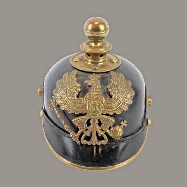 An original Imperial German Prussian M1895 Artillery Pickelhaube, or Kugelhelm, issued to enlisted ranks (Mannschaften)...