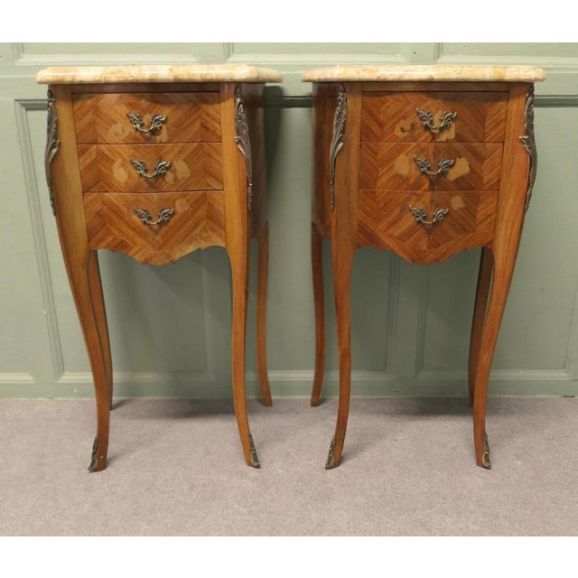 A Pair of Inlaid French Marquetry and Marble Bombe Shaped Bedside Chevets These are a pair of French Louis XVI style...