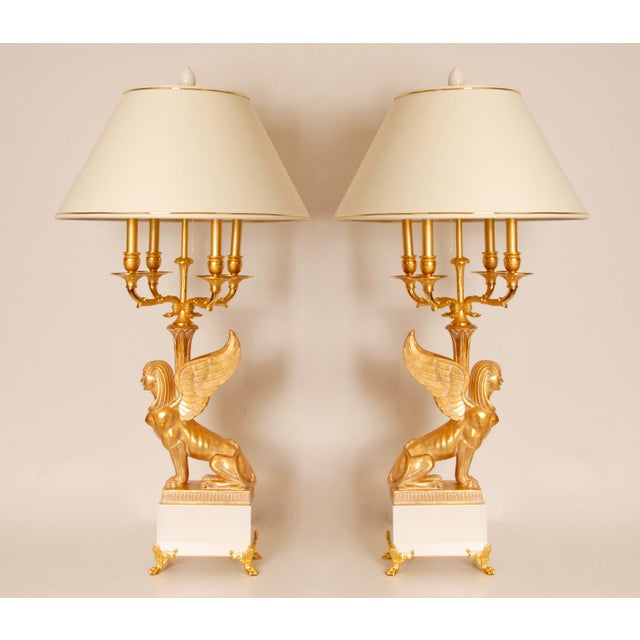Tall Figural Empire Table Lamps Egyptian revival known as Retour d'Egypt. Depicting a Winged Sphinx made of giltwood on a...