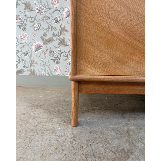 A testament to post-war french craftsmanship, this vintage wardrobe from the 1950s/60s perfectly embodies the understated...