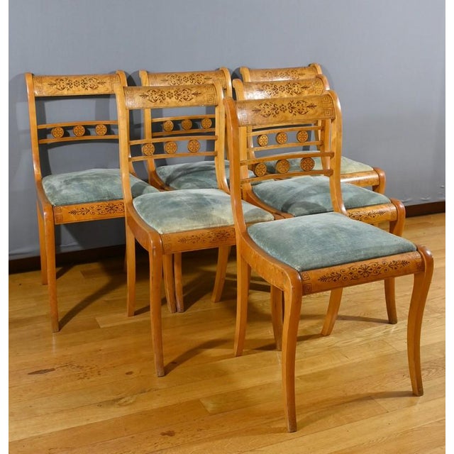 This suite of six bird's-eye maple chairs, in the Charles The curved back of each chair is embellished with rosewood...