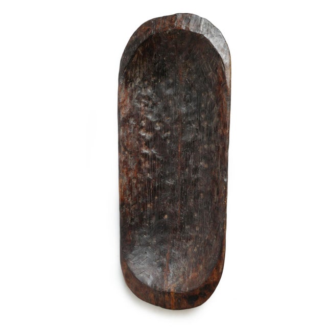 Monumental antique Naga carved wood bowl hewn by hand from a single massive hardwood log. Dates to the early 20th century...