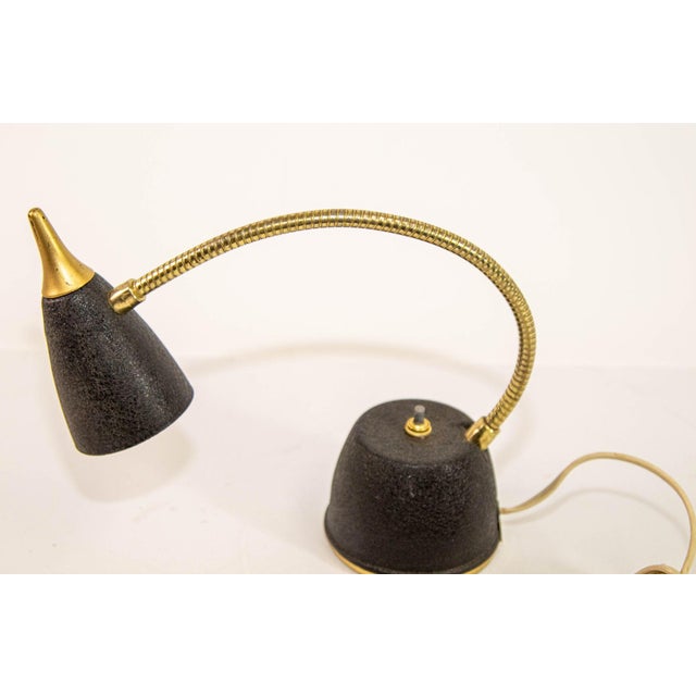 Mid-Century Modern Brass Gooseneck Desk Lamp, Black & Gold, USA, circa 1950s A refined and functional mid-century...