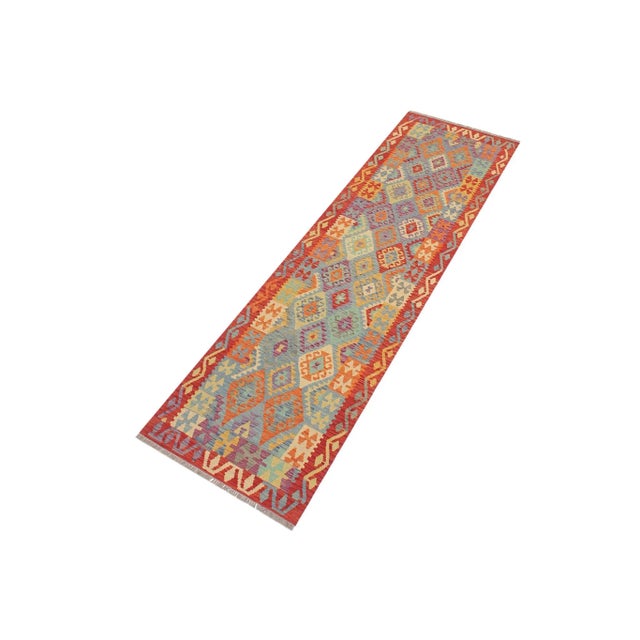 Add a touch of elegance to your home with this casual chic hand woven Tribal Kilim wool rug. Constructed on a loom by...