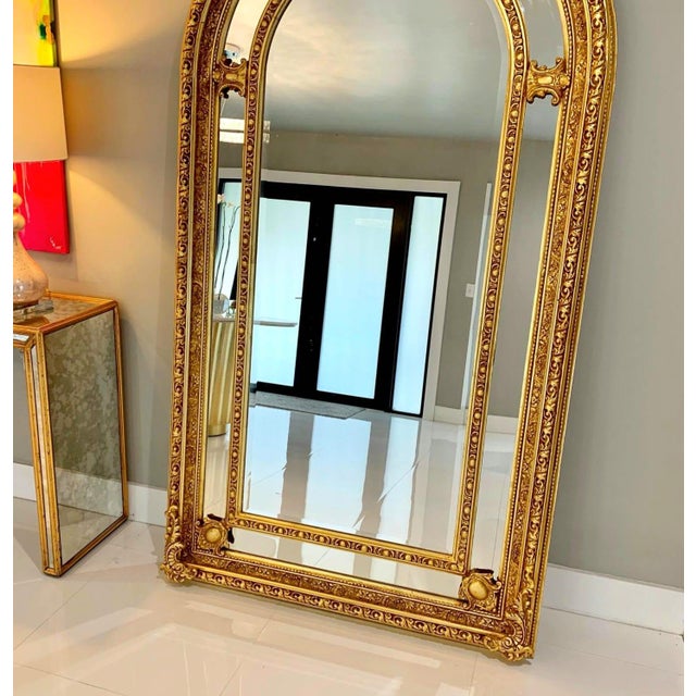 This French style gold floor/wall mirror is a grand statement piece that combines elegant design with exceptional...