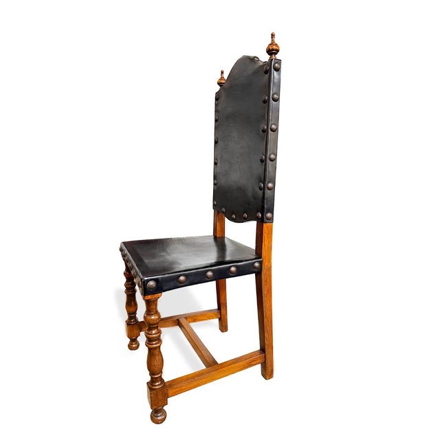 These Vintage Portuguese Oak Dining Chairs, dating to the 1970s, draw inspiration from traditional 18th-century Portuguese...