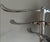 Stylish freestanding coat rack with a polished chrome finish and a clean, modern design. Features multiple curved hooks at...