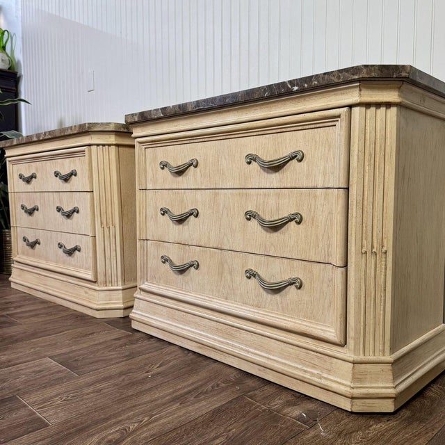 Beautiful vintage pair of nightstands by Bernhardt featuring substantial genuine marble tops and an elegant, European-...
