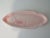 Large serving dish in pink glazed ceramic with salmon motif in relief. The dish was made in France at Salins les Bains...