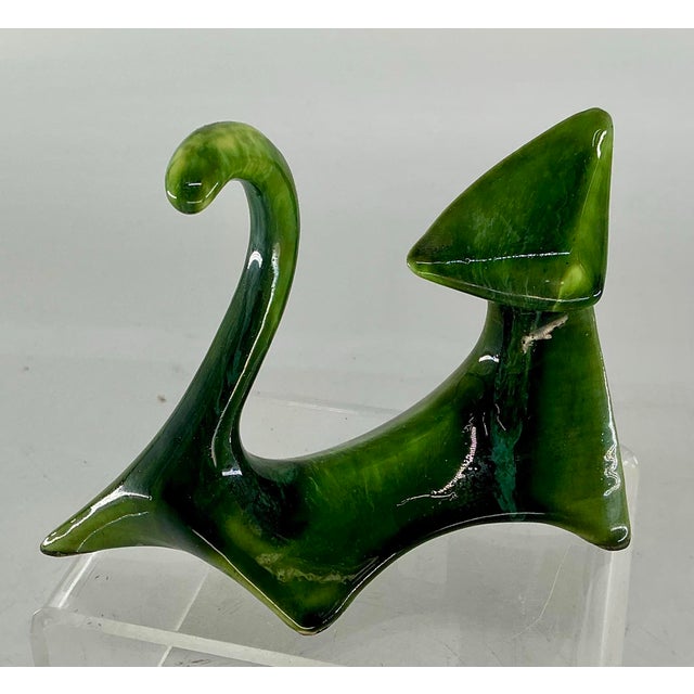 Minimalistic mid century ceramic cat figurine glazed in the shades of green. Original paper label from pottery studio in...