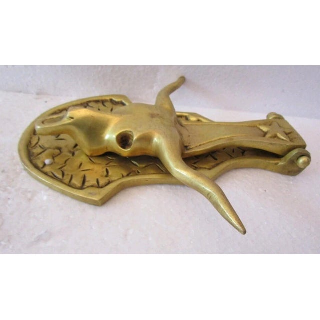 This solid brass longhorn steer door knocker is a great accent for ranch, cowboy or southwestern themed house. A star at...