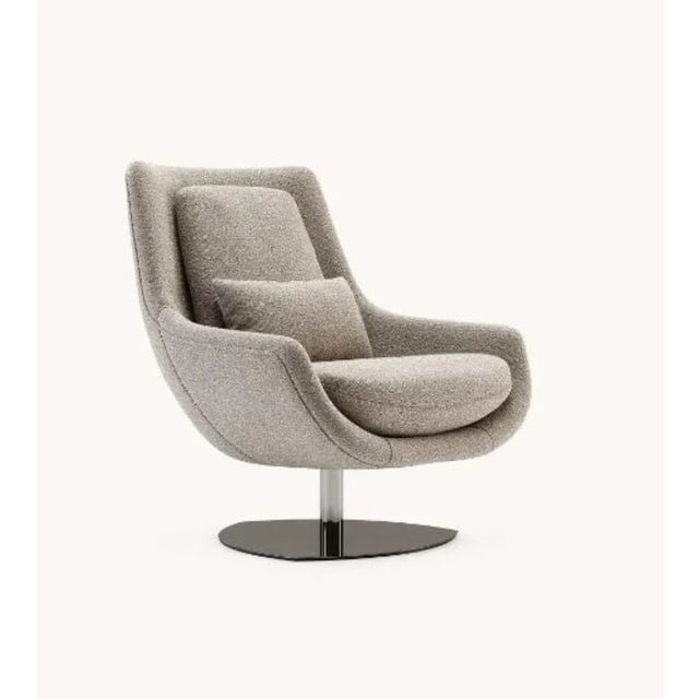 Elba armchair by Domkapa Materials: Bouclé, Polished Stainless Steel. Dimensions: W 87 x D 88 x H 100 cm. Also available...
