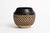 A hand-thrown ovoid vessel by New York potter Walter Yovaish, crafted in stoneware with minimalist design. The smooth tan...