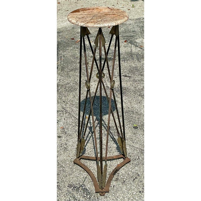 Elevate your interior with this exceptional Vintage Regency Wrought Iron and Brass Arrow Pedestal, a testament to enduring...