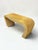 A striking vintage pencil reed waterfall console table showcasing the timeless elegance of 1970s Organic Modern design,...