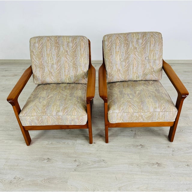 Dimensions: H 32.7” x W 29.3” x D 28.5” x SH 18” Pair of Vintage Danish teak easy chairs with original upholstered...