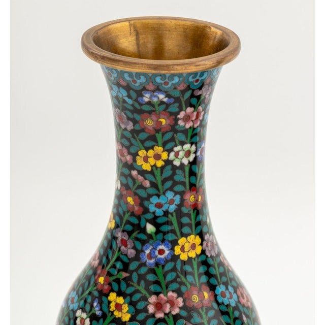 Pair of Chinese Cloisonne Floral Design Vases, polychrome flowers and vines on black grounds, each on carved wood base....