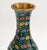 Pair of Chinese Cloisonne Floral Design Vases, polychrome flowers and vines on black grounds, each on carved wood base....