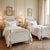 Beautiful pair of mid-century American-made French Provincial / Louis XVI twin beds finished in a distressed Creme Peinte...