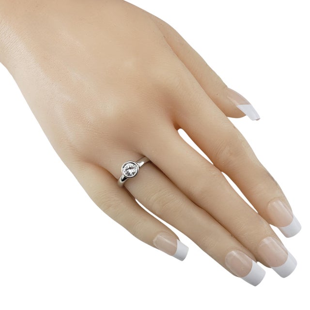 14 Karat White Gold Diamond Engagement Ring Size 5.25 JAGi Certified- This elegant engagement ring features one round...