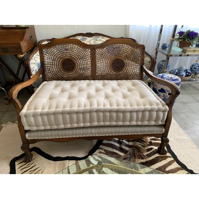 Here we have a gorgeous old cane back English Oak bench or settee. This one has been recently refreshed with a new firm...