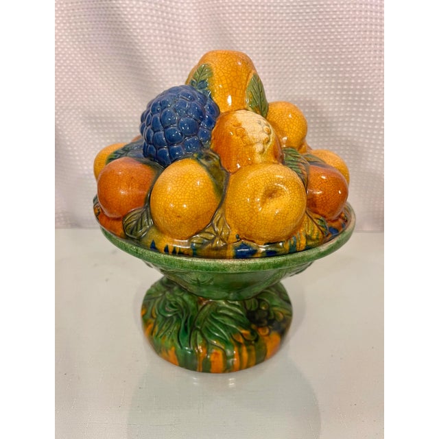 This vintage Majolica Style Fruit Stacked Lidded Bowl/Catchall Decor by CBK is a delightful piece that will add a pop of...